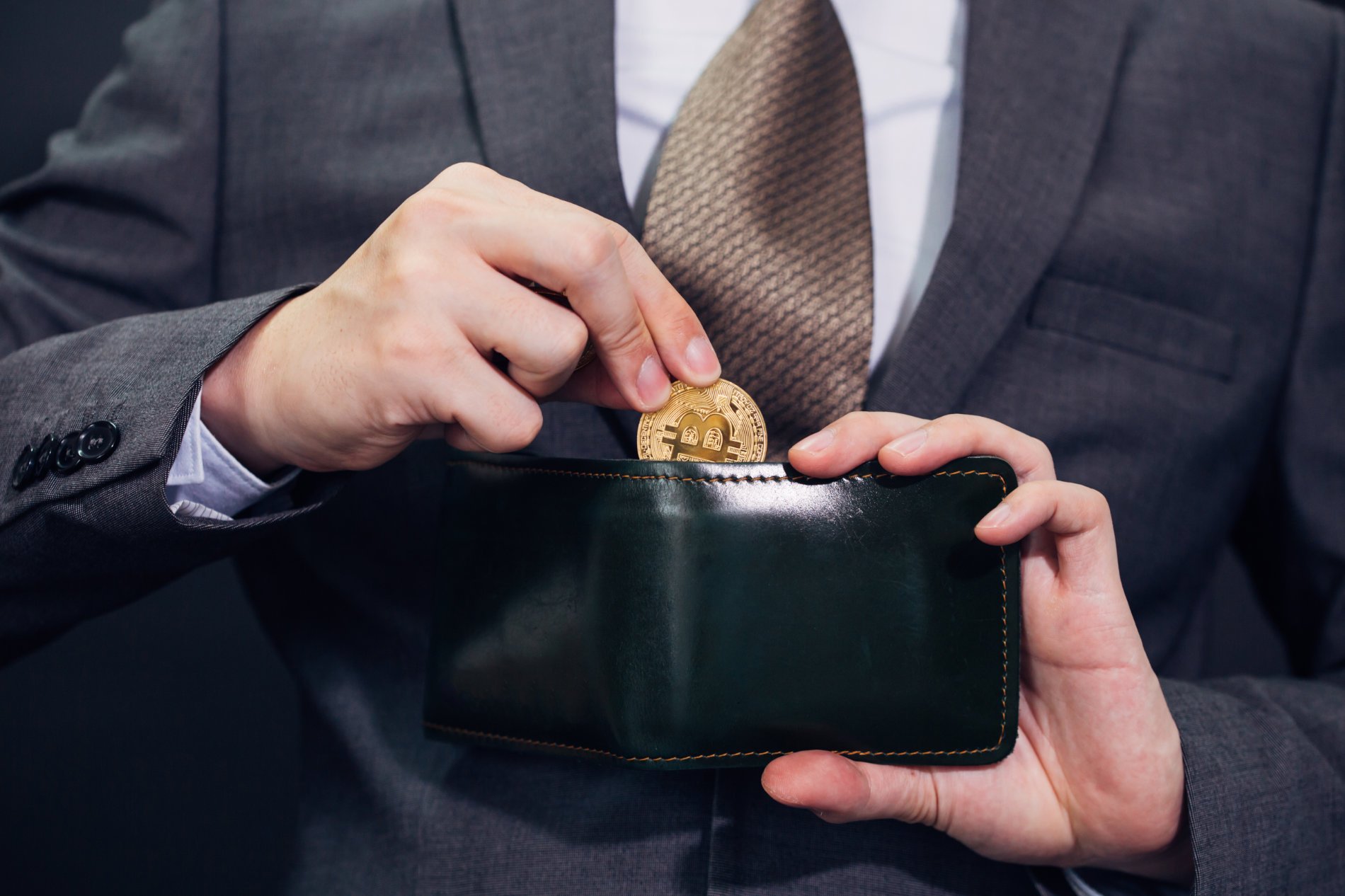close-up-of-businessman-with-wallet-receiving